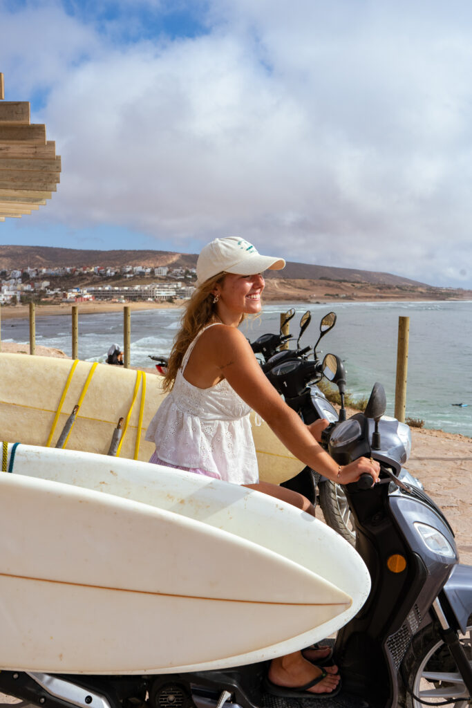 Scooter on the road with Tamraght ocean in background