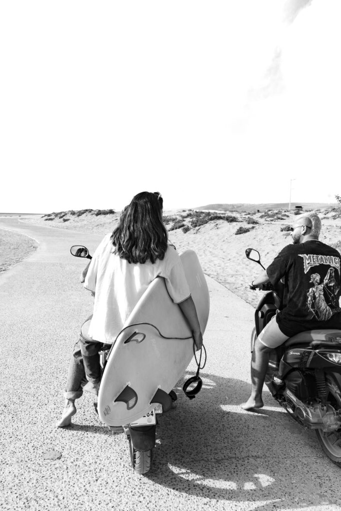 Owners driving the scooters along the beach in Tamraght