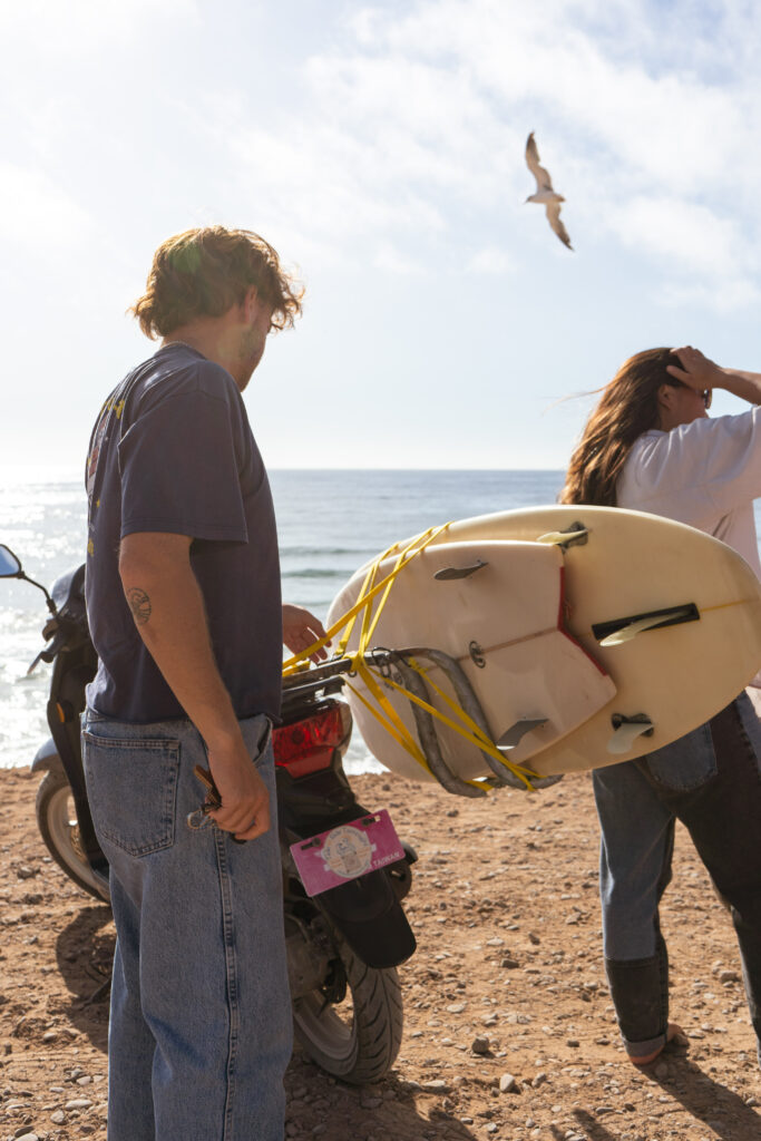 Customers parking the scooter near the beach